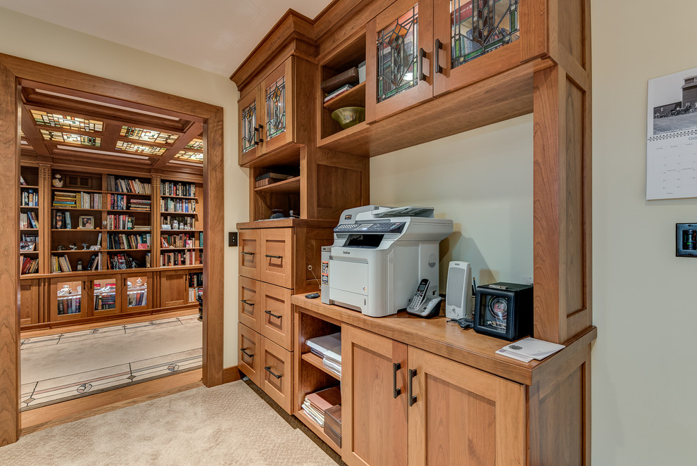 Inspiration for a mid-sized arts and crafts home office in Chicago with a freestanding desk, beige walls and carpet.