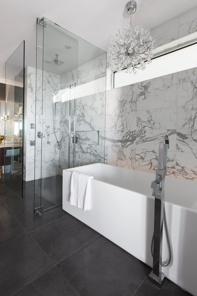 Inspiration for a contemporary master bathroom in Vancouver with a freestanding tub, a curbless shower, ceramic floors, grey floor, a hinged shower door and white tile.