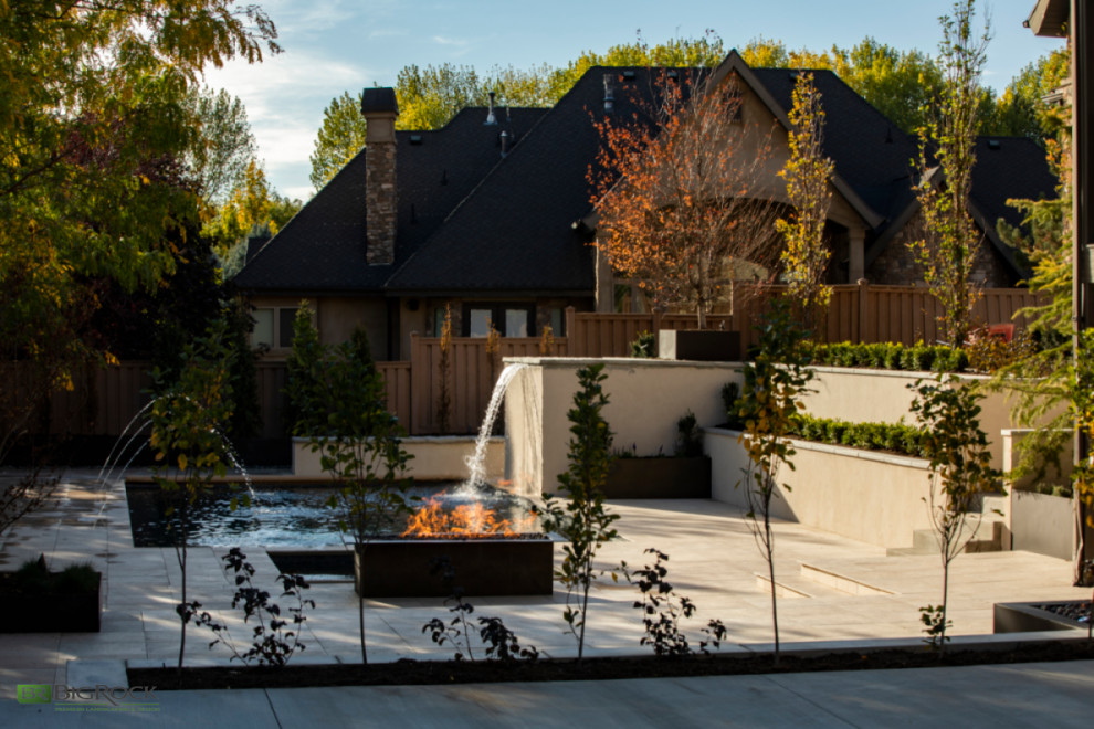 Photo of a contemporary back garden in Salt Lake City with a retaining wall.