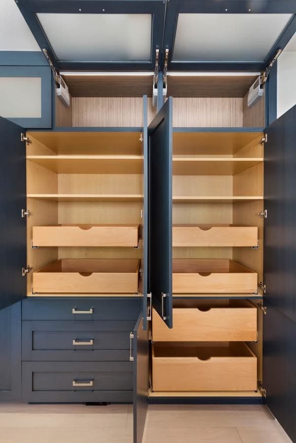 Example of a transitional kitchen design in Denver with blue cabinets