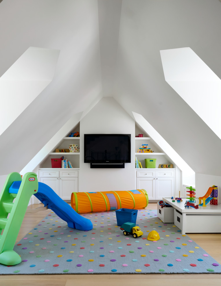 Photo of a transitional gender-neutral kids' room in Dallas with white walls and light hardwood floors.
