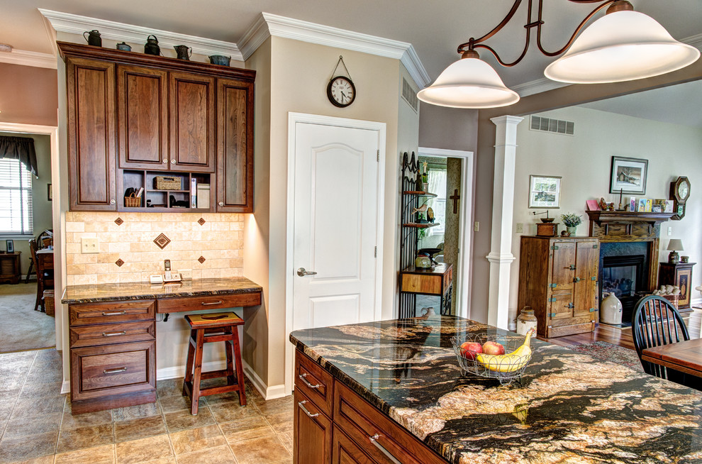 Mid-sized traditional l-shaped kitchen in Philadelphia with a single-bowl sink, raised-panel cabinets, white cabinets, granite benchtops, beige splashback, stone tile splashback, stainless steel appliances, vinyl floors, with island and beige floor.