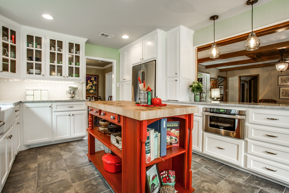 Mid-sized country u-shaped separate kitchen in Dallas with recessed-panel cabinets, white cabinets, white splashback, subway tile splashback, stainless steel appliances, with island, a farmhouse sink, porcelain floors, grey floor and quartzite benchtops.