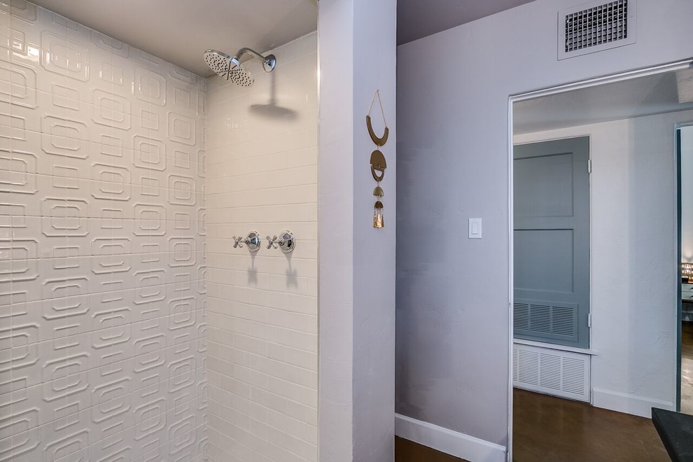 Alcove shower - mid-sized transitional 3/4 white tile and subway tile concrete floor and brown floor alcove shower idea in Phoenix with gray walls and a hinged shower door