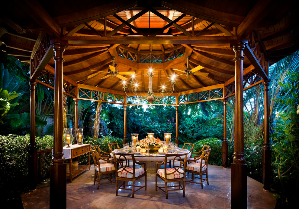 Tropical patio in New York with a gazebo/cabana.
