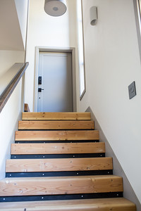 Staircase - mid-sized rustic wooden l-shaped metal railing staircase idea with tile risers