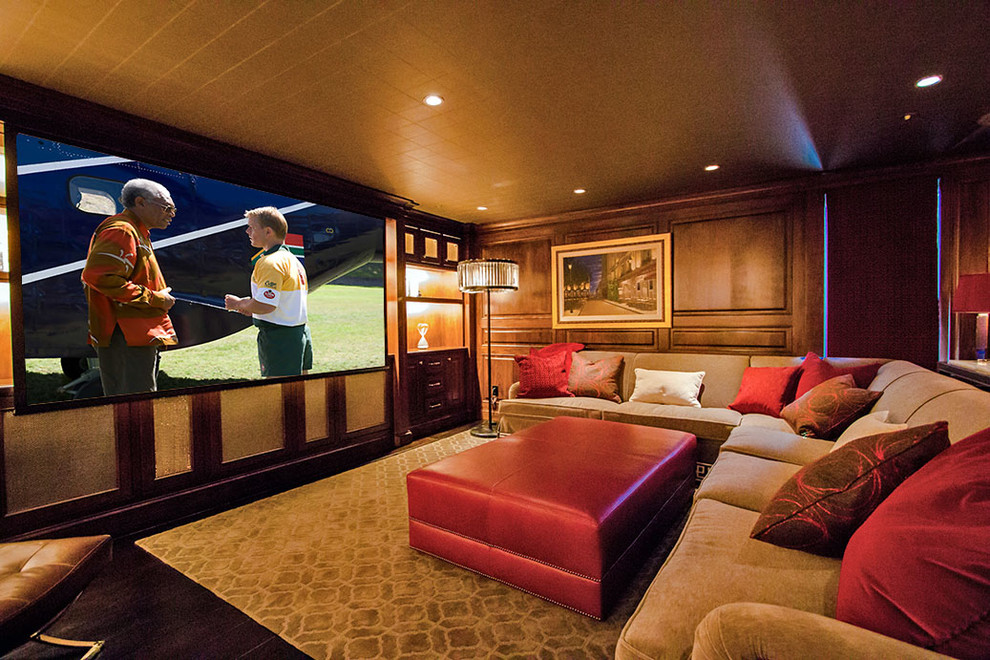 Photo of a mid-sized arts and crafts enclosed home theatre in San Francisco with brown walls, dark hardwood floors and a projector screen.
