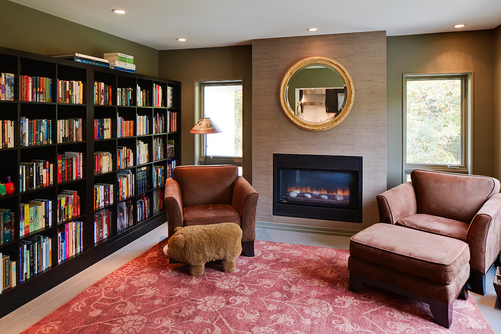 Design ideas for a mid-sized contemporary open concept family room in Detroit with a library, beige walls, a standard fireplace, porcelain floors, a metal fireplace surround, no tv and beige floor.