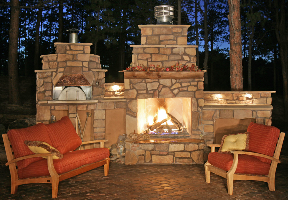 Photo of a small traditional backyard patio in Denver with a fire feature, tile and no cover.