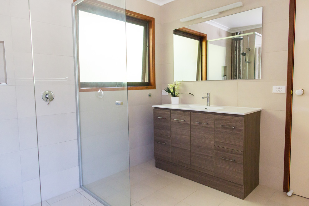 This is an example of a mid-sized contemporary master bathroom in Canberra - Queanbeyan with an alcove tub, white tile, ceramic tile, white walls, ceramic floors and beige floor.