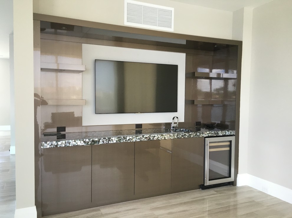 Photo of a mid-sized contemporary single-wall wet bar in Miami with an undermount sink, flat-panel cabinets, brown cabinets, terrazzo benchtops, brown splashback, light hardwood floors and beige floor.