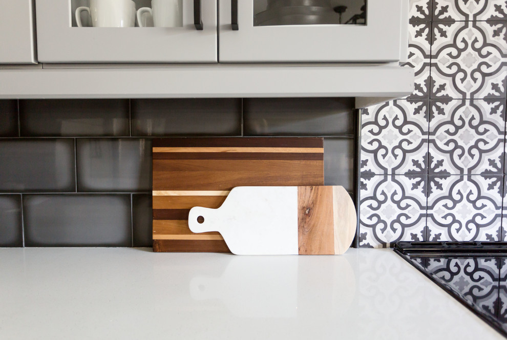 Inspiration for a mid-sized transitional u-shaped light wood floor and gray floor eat-in kitchen remodel in Phoenix with an undermount sink, recessed-panel cabinets, gray cabinets, quartz countertops, multicolored backsplash, ceramic backsplash, stainless steel appliances, an island and white countertops