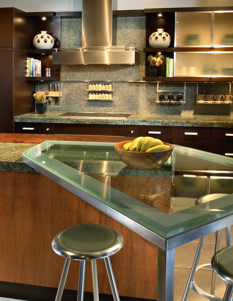 Inspiration for a mid-sized transitional ceramic tile eat-in kitchen remodel in Phoenix with flat-panel cabinets, medium tone wood cabinets, granite countertops, multicolored backsplash, glass tile backsplash, stainless steel appliances and an island
