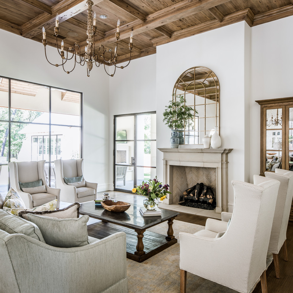 Open concept living room in Dallas with white walls, dark hardwood floors and a standard fireplace.