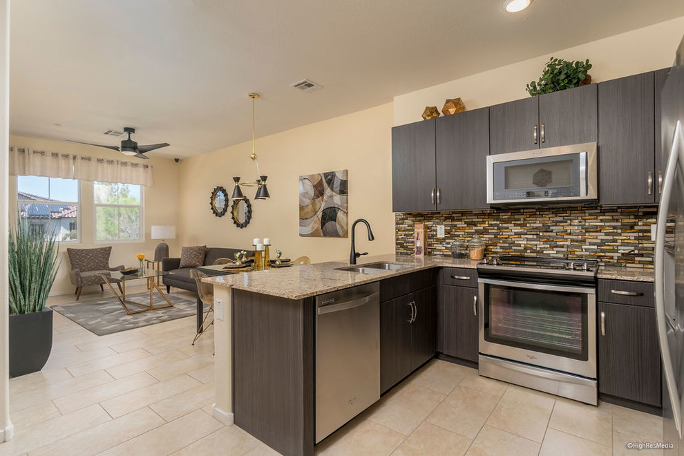 Inspiration for a mid-sized transitional u-shaped porcelain tile and beige floor eat-in kitchen remodel in Phoenix with an undermount sink, flat-panel cabinets, dark wood cabinets, granite countertops, multicolored backsplash, matchstick tile backsplash, stainless steel appliances, a peninsula and multicolored countertops