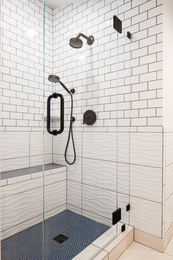 Design ideas for a mid-sized eclectic bathroom in Other with white cabinets, an alcove shower, a two-piece toilet, white tile, ceramic tile, white walls, limestone floors, a pedestal sink, beige floor, a hinged shower door, a shower seat, a single vanity, a freestanding vanity and vaulted.