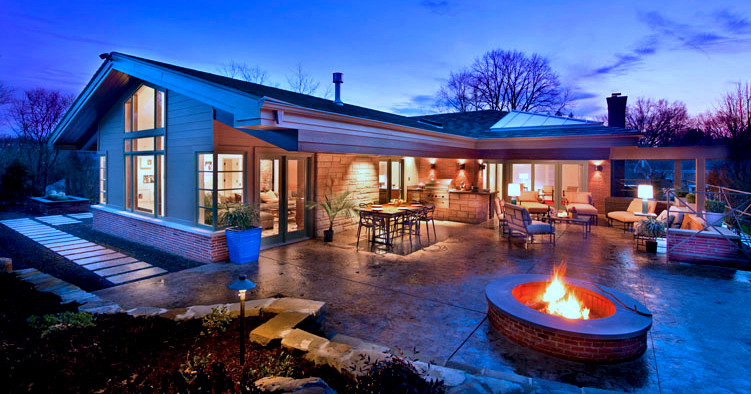 Photo of a large contemporary backyard patio in Other with an outdoor kitchen, stamped concrete and a roof extension.