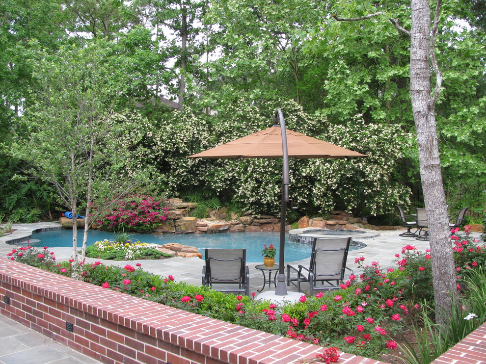 Photo of a traditional custom-shaped pool in Houston.