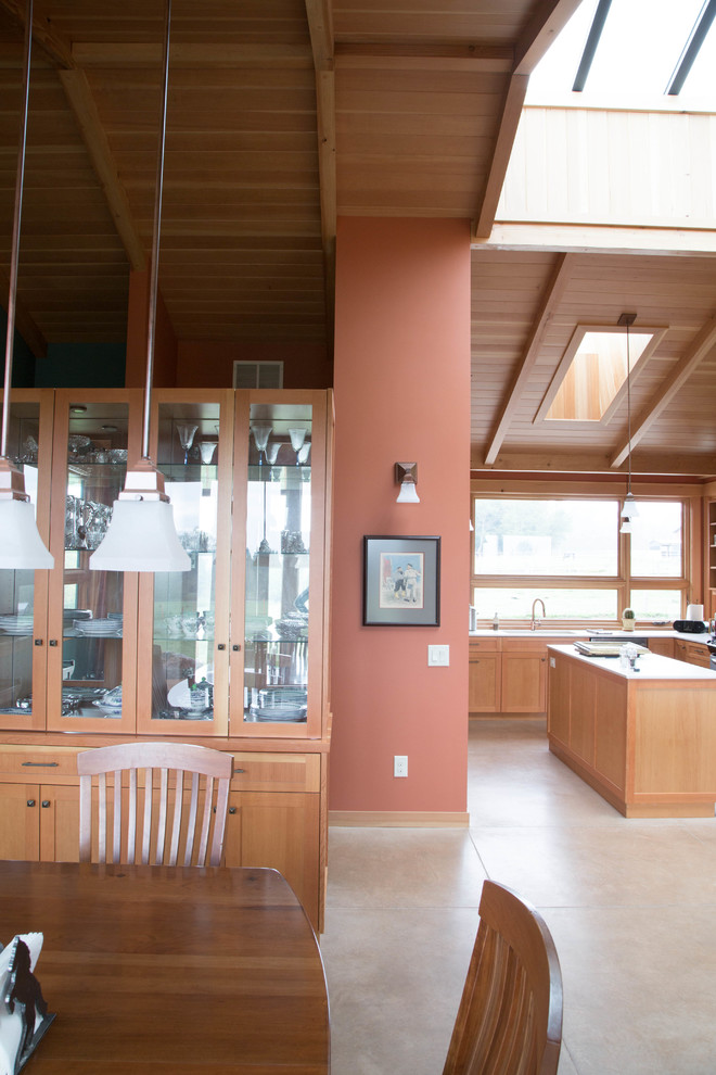 This is an example of a mid-sized contemporary open plan dining in Seattle with red walls.