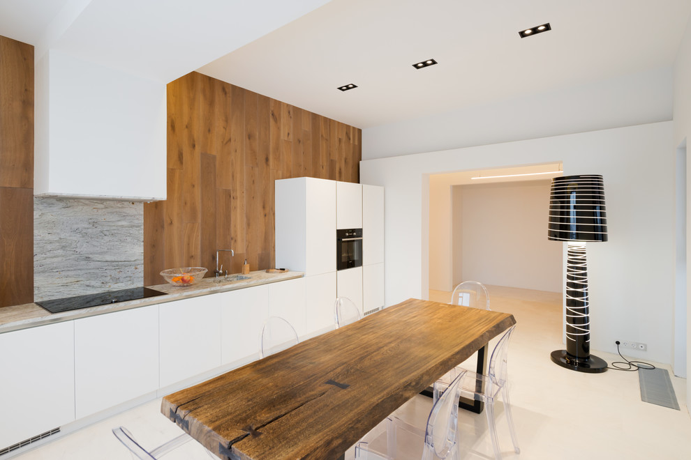 Scandinavian single-wall separate kitchen in Moscow with an integrated sink, flat-panel cabinets, white cabinets, brown splashback, black appliances and beige floor.