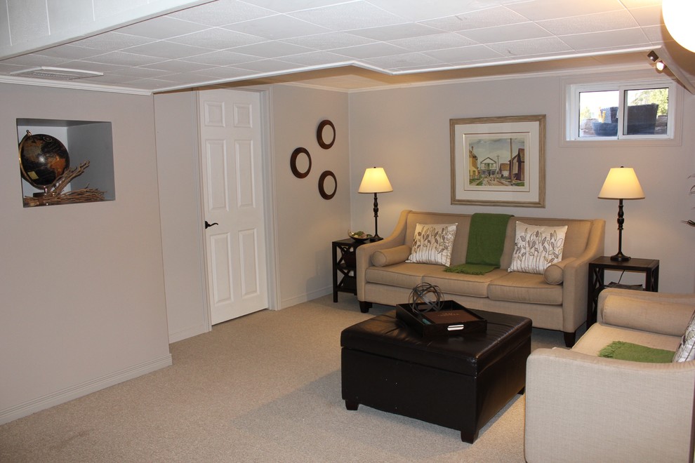 Inspiration for a mid-sized transitional look-out basement in Toronto with beige walls, carpet, no fireplace and beige floor.