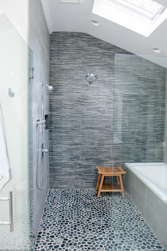Large transitional master bathroom in Portland Maine with flat-panel cabinets, light wood cabinets, a corner tub, an alcove shower, a two-piece toilet, white tile, white walls, ceramic floors and an undermount sink.