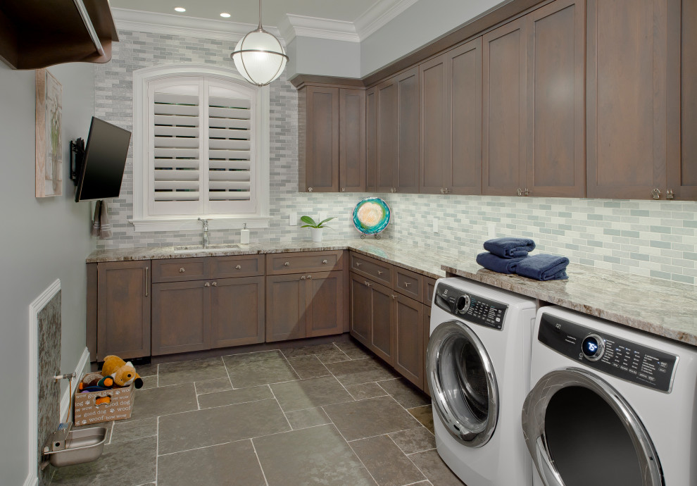 L-shaped dedicated laundry room in Baltimore with a single-bowl sink, shaker cabinets, brown cabinets, grey walls, a side-by-side washer and dryer, grey floor and multi-coloured benchtop.