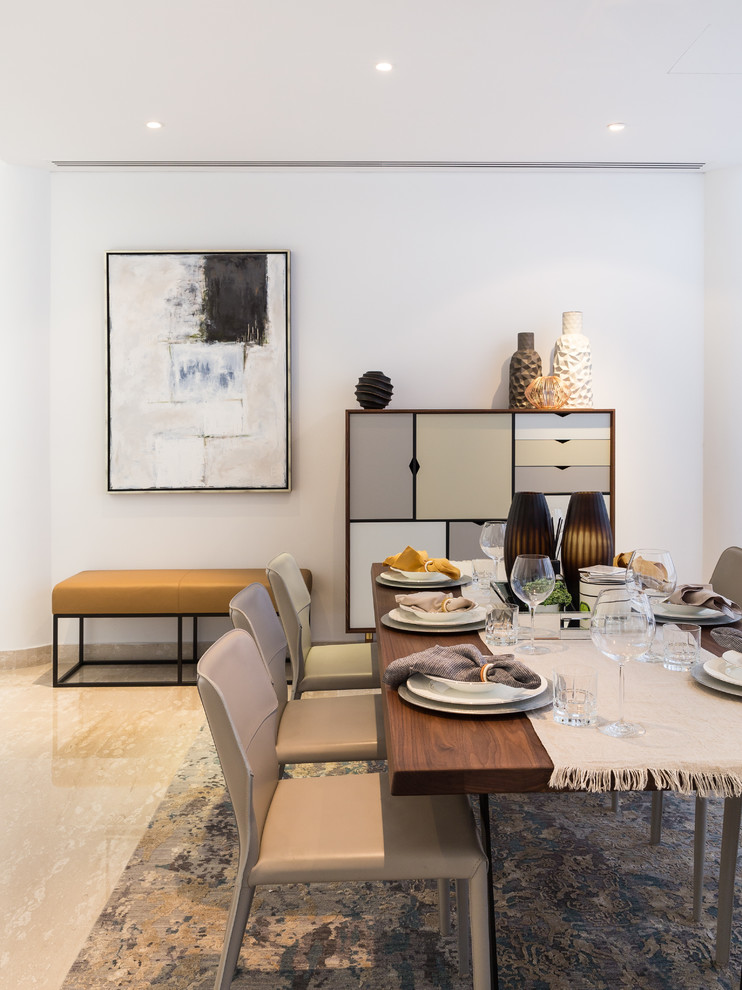 Inspiration for a contemporary dining room in Singapore with white walls.