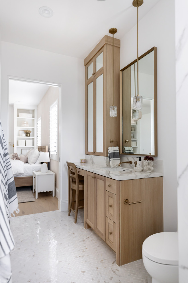 Worth the Wait - Bathroom - transitional mosaic tile floor, white floor and single-sink bathroom idea in Phoenix with recessed-panel cabinets, light wood cabinets, white walls, an undermount sink, white countertops and a built-in vanity
