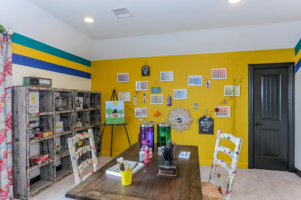 Mid-sized gender-neutral kids' playroom in Dallas with carpet and multi-coloured walls for kids 4-10 years old.