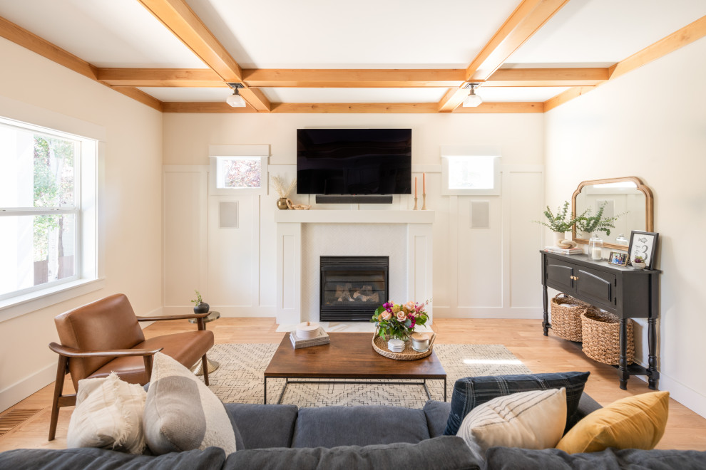 Inspiration for a contemporary living room in Portland with light hardwood floors, a standard fireplace, a wall-mounted tv, exposed beam and decorative wall panelling.