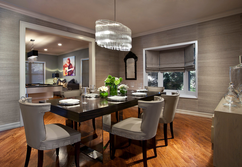 Contemporary dining room in New York with grey walls.