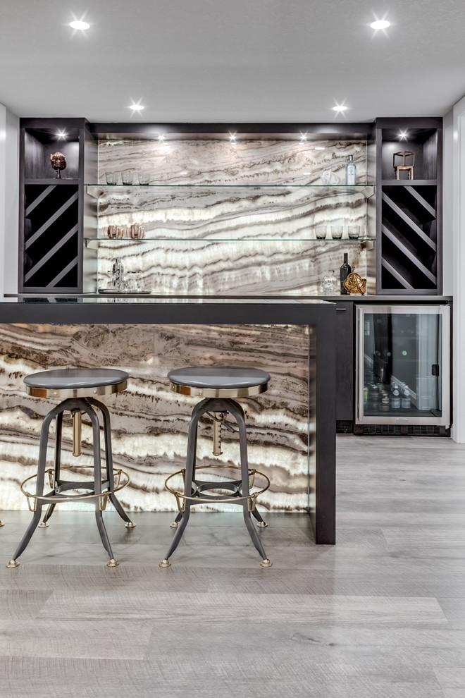 Design ideas for a mid-sized contemporary galley seated home bar in Calgary with no sink, flat-panel cabinets, brown cabinets, quartz benchtops, multi-coloured splashback, stone slab splashback, vinyl floors, grey floor and brown benchtop.