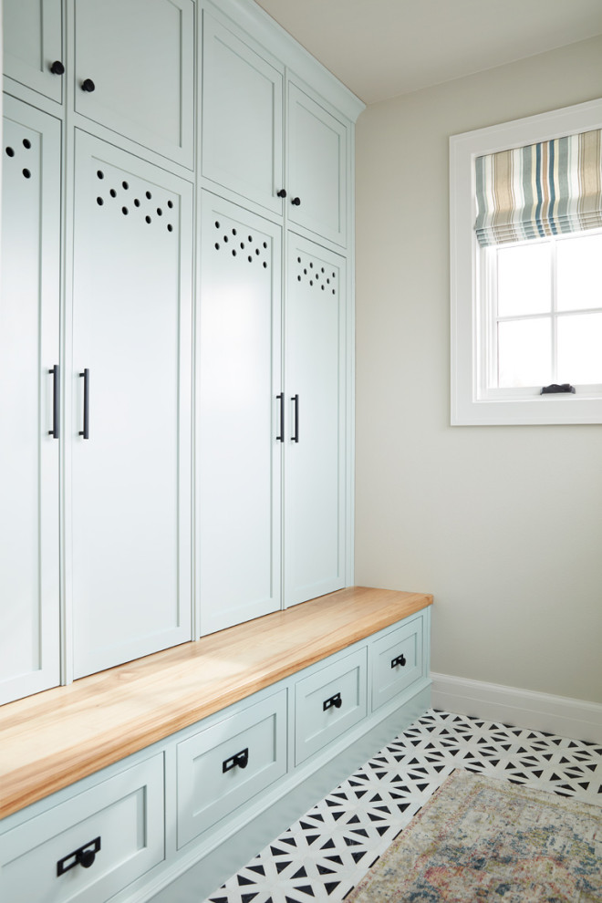 Dedicated laundry room - mid-sized transitional dedicated laundry room idea with recessed-panel cabinets and blue cabinets