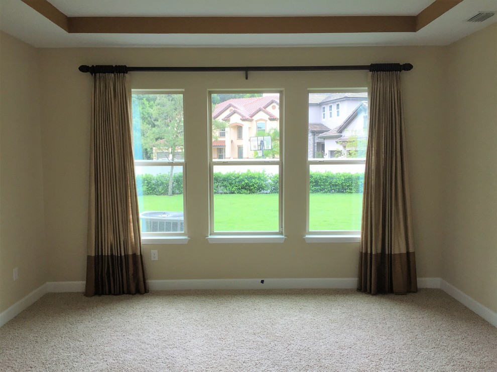 Example of a mid-sized transitional guest dark wood floor and brown floor hallway design in Tampa with gray walls