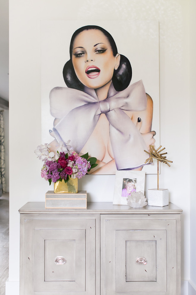 Mid-sized transitional light wood floor foyer photo in Orange County with white walls