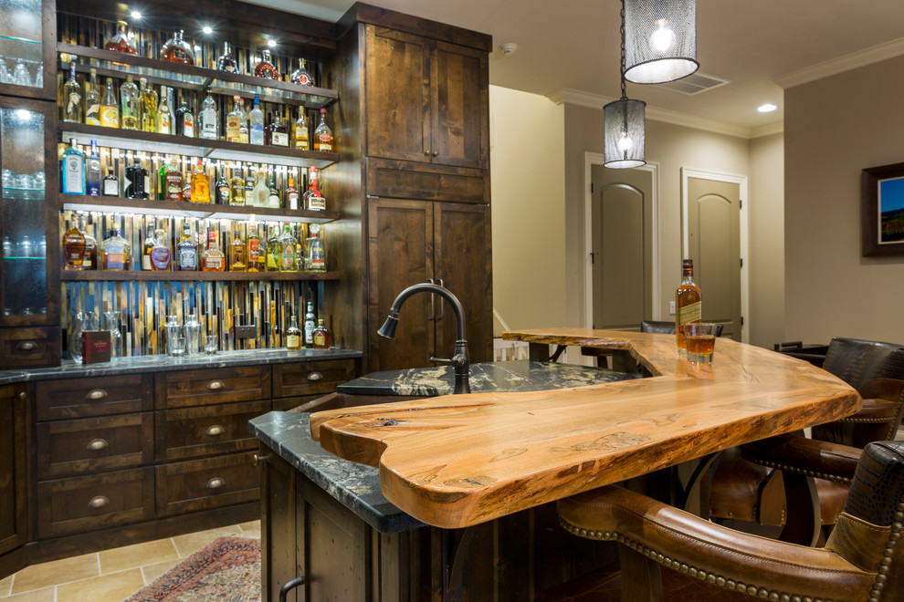 Design ideas for a large country u-shaped seated home bar in Charlotte with an undermount sink, dark wood cabinets, wood benchtops, brown splashback, mosaic tile splashback and slate floors.