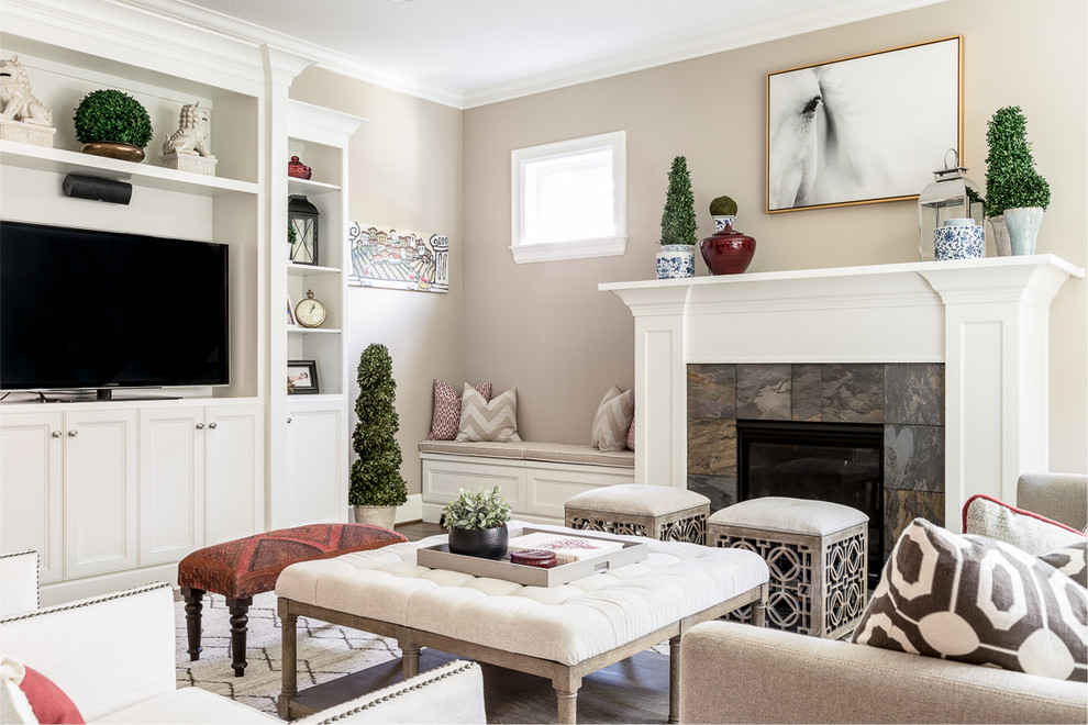 Inspiration for a mid-sized transitional open concept family room in Portland with beige walls, a standard fireplace, a tile fireplace surround, a built-in media wall, dark hardwood floors and brown floor.