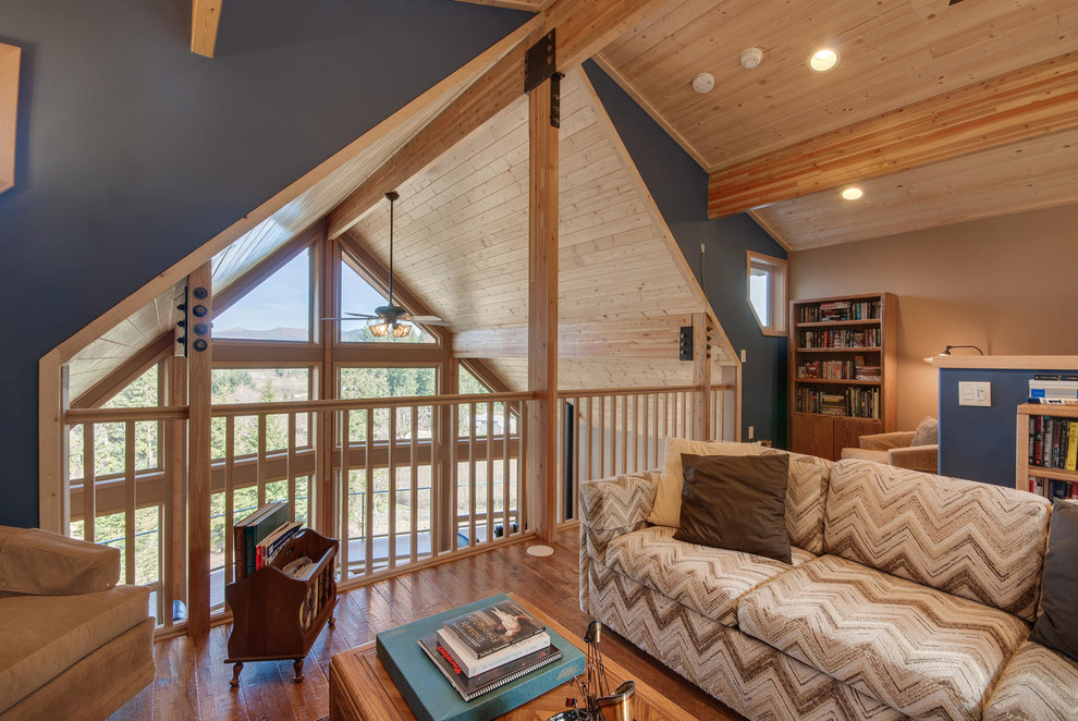 Mid-sized arts and crafts loft-style family room in Portland with medium hardwood floors.