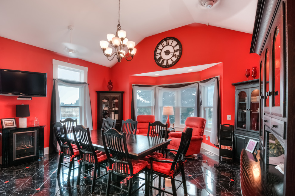 This is an example of a large country kitchen/dining combo in Other with red walls and ceramic floors.