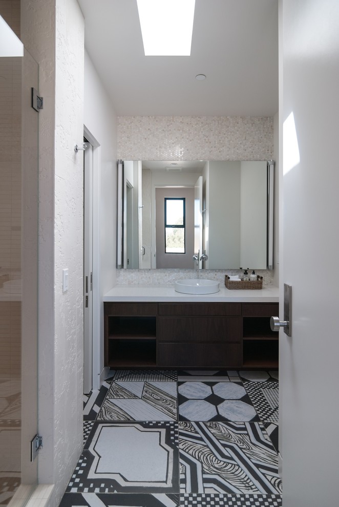 Mid-sized modern 3/4 bathroom in San Diego with porcelain tile, a vessel sink, flat-panel cabinets, dark wood cabinets, an alcove shower, white tile, white walls, mosaic tile floors and quartzite benchtops.