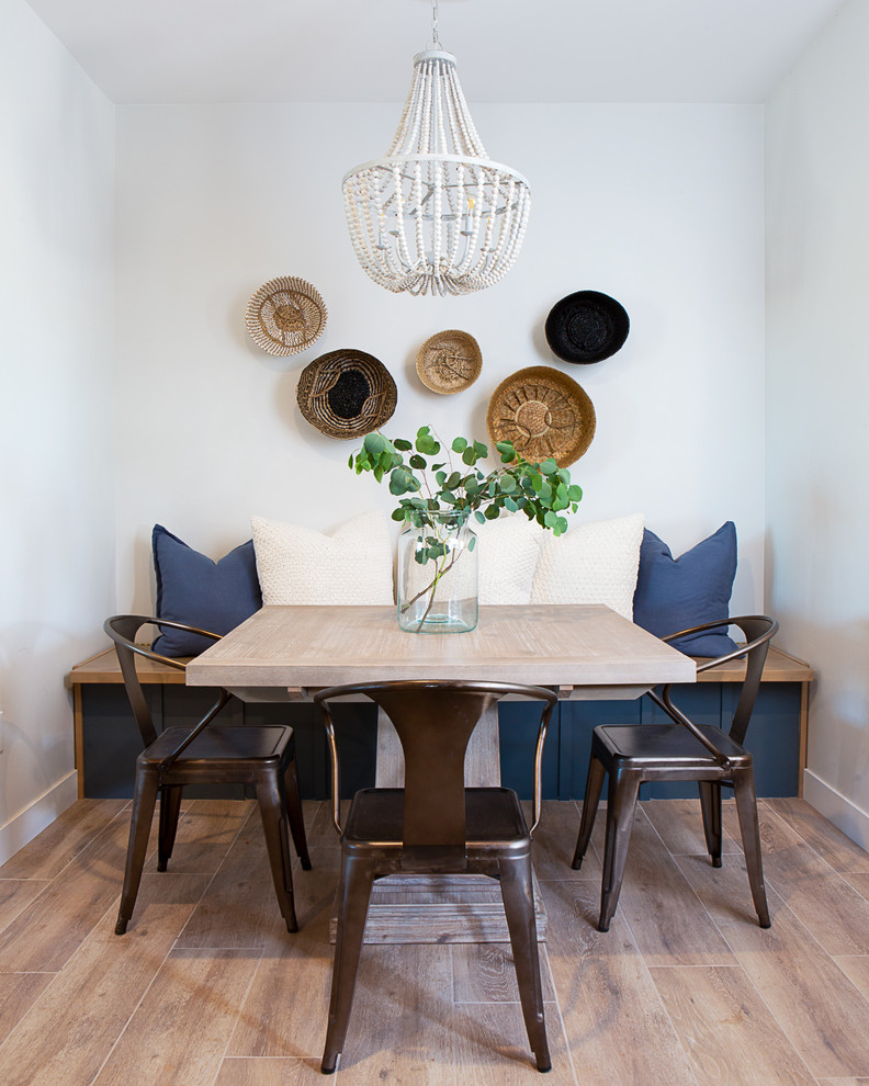 Inspiration for a mid-sized country open plan dining in Phoenix with porcelain floors and brown floor.