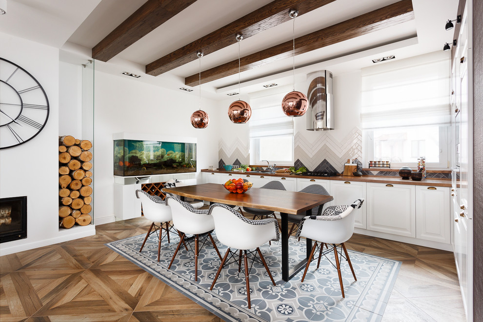 Inspiration for a scandinavian l-shaped open plan kitchen in Other with raised-panel cabinets, white cabinets, multi-coloured splashback, medium hardwood floors and no island.