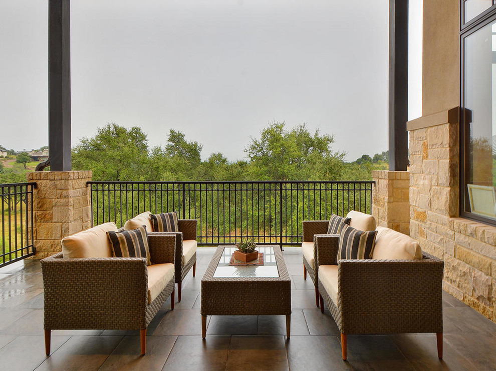 Design ideas for a large contemporary two-storey house exterior in Austin with stone veneer.