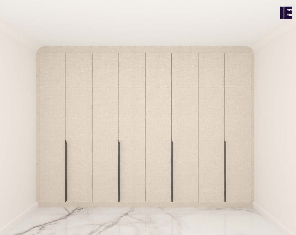 Design ideas for a small contemporary built-in wardrobe in London with flat-panel cabinets, beige cabinets, marble flooring and feature lighting.