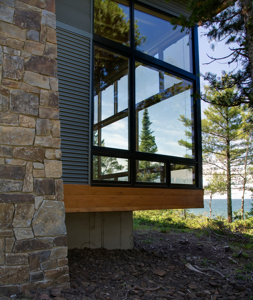 Inspiration for a small modern two-storey exterior in Seattle with metal siding.