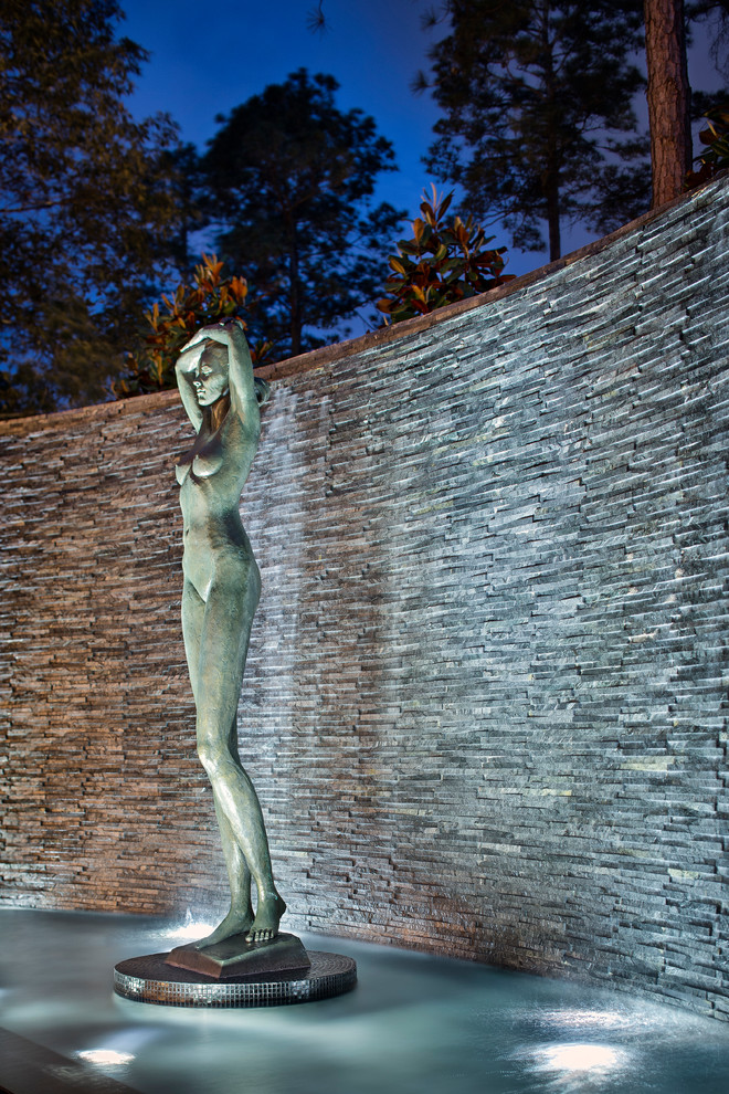 Pool fountain - huge transitional backyard custom-shaped pool fountain idea in Houston