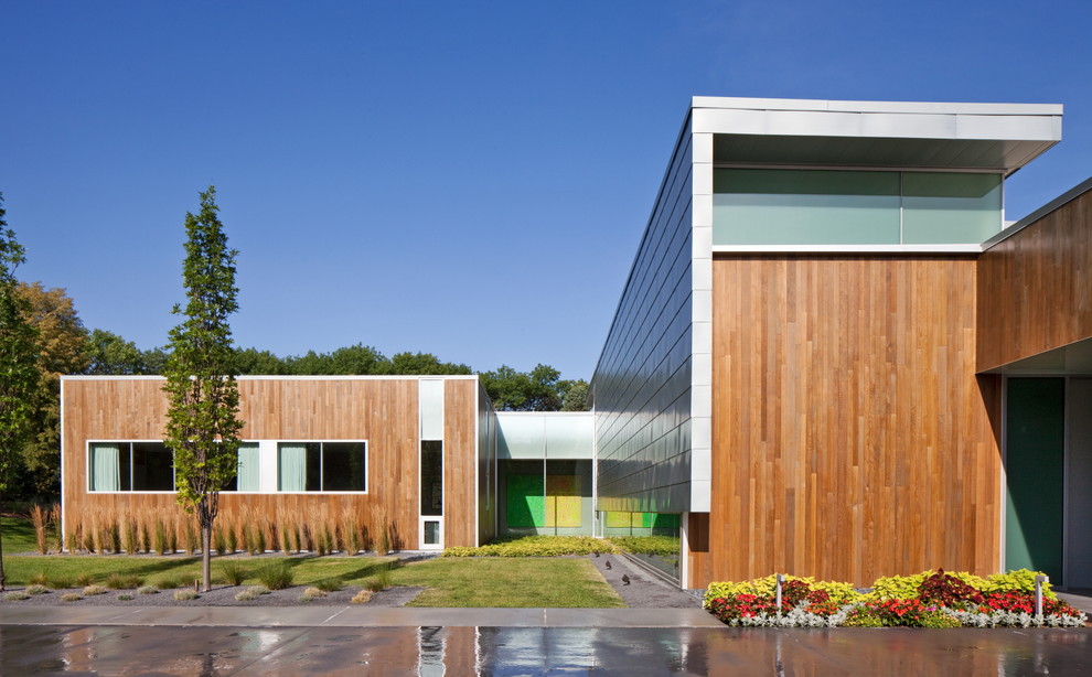 Inspiration for a contemporary exterior in Omaha with wood siding.