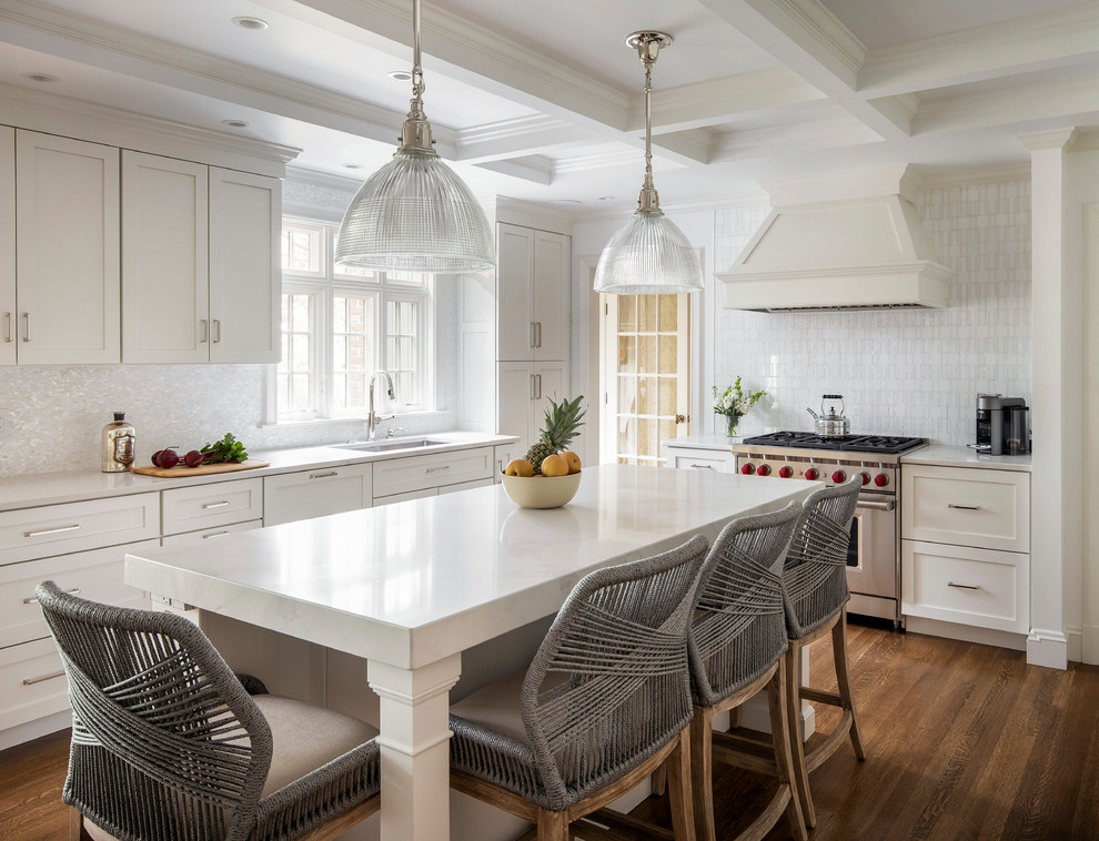 Design ideas for a mid-sized transitional u-shaped separate kitchen in Boston with an undermount sink, shaker cabinets, yellow cabinets, quartz benchtops, white splashback, mosaic tile splashback, panelled appliances, medium hardwood floors, with island and white benchtop.