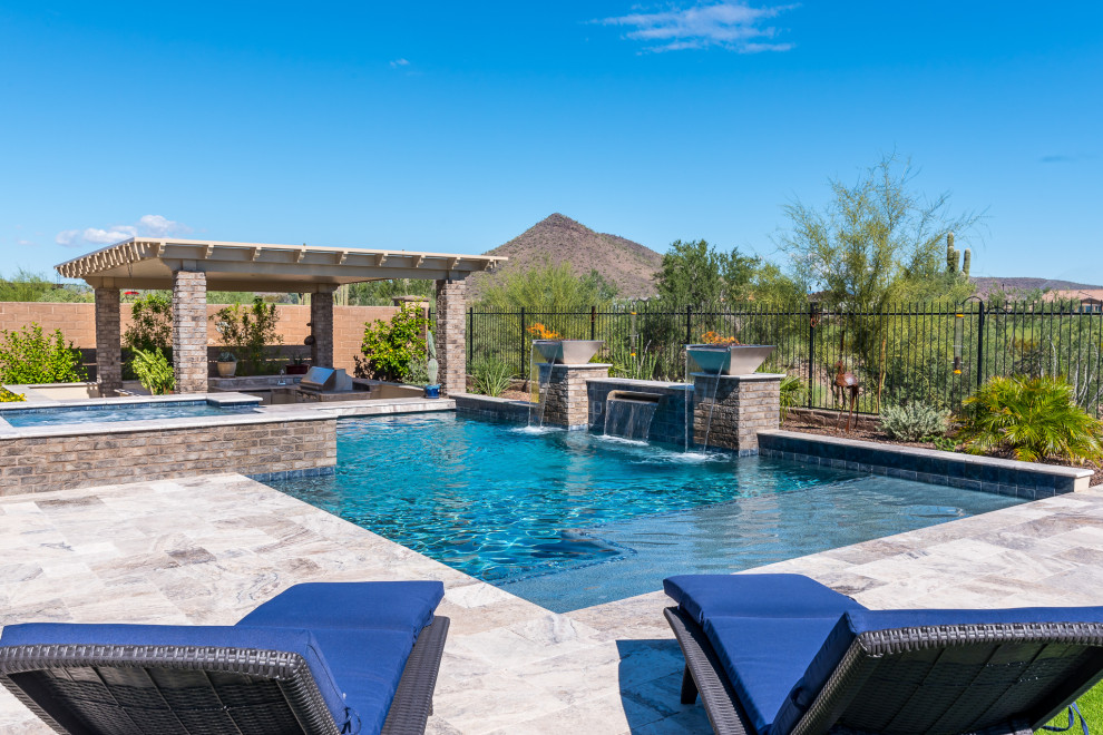Design ideas for a mid-sized backyard rectangular pool in Phoenix with a hot tub and natural stone pavers.